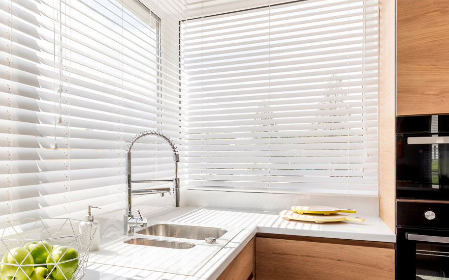 White polywood blinds in a kitchen